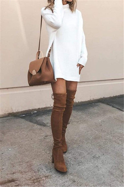 Close-up of the cowl neck and fabric detail of the white tunic sweater dress.