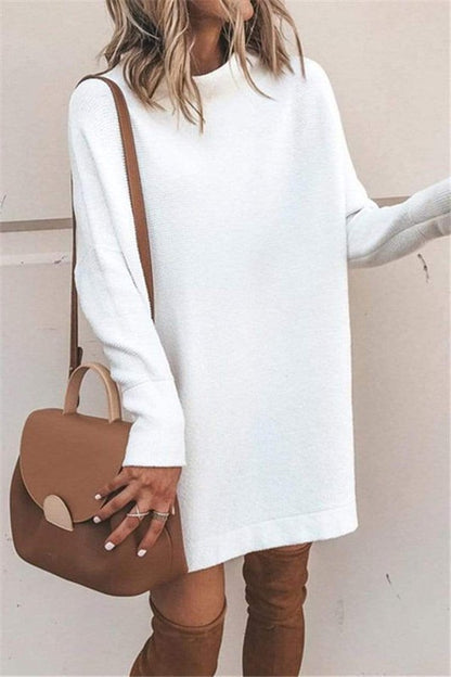 Close-up of the cowl neck and fabric detail of the white tunic sweater dress.