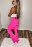 Back view of the pink wide leg jeans, showing the high-waisted fit.